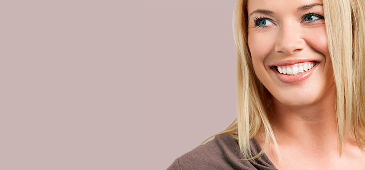 Smiling young woman looking left