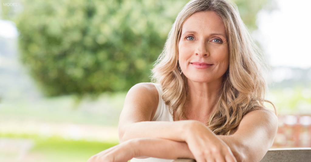 Woman smiling after receiving dermal fillers around the eye area in Nashville, TN