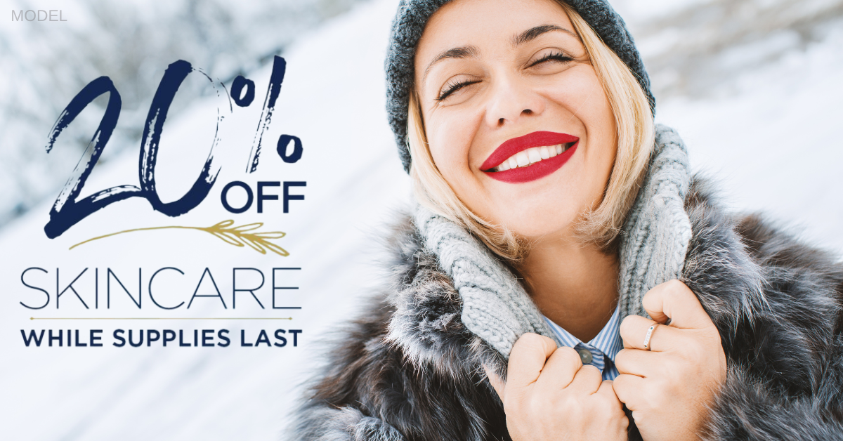 Woman with red lipstick smiling while outside in the snow (model) with text that reads 20% off skincare while supplies last
