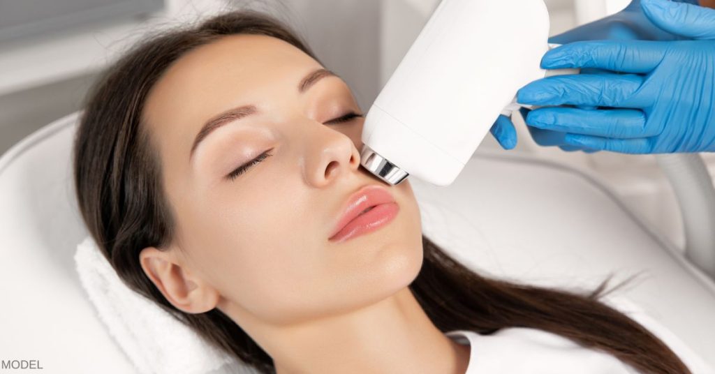 A woman undergoing a laser skin resurfacing treatment (model)