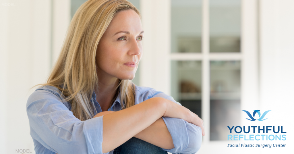 woman contemplating about blepharoplasty (model)