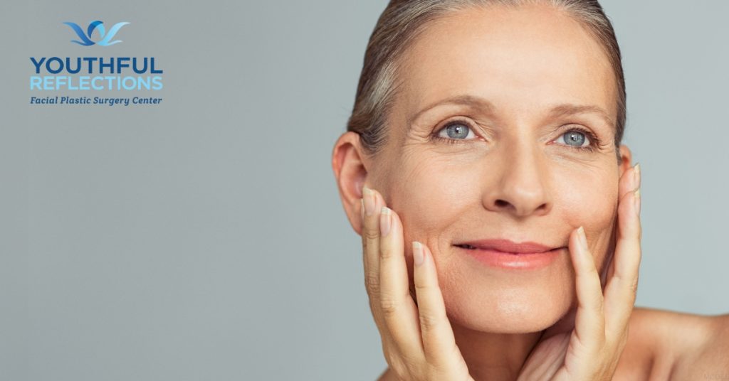 Woman showing off her facial plastic surgery results (model)